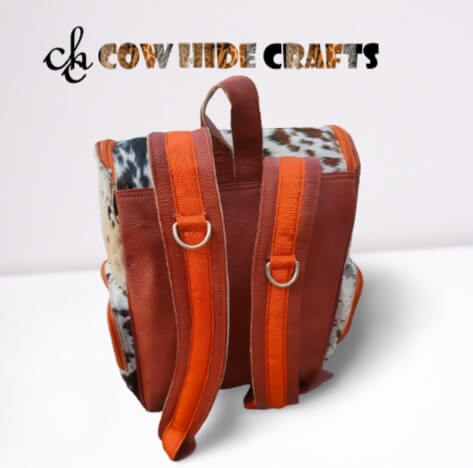 Tan and white rodeo cowgirl rucksack.