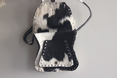 Side body leather bag black and white cowhide flap closure