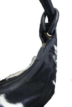 Curvy half sphere cowhide handbag with leather base