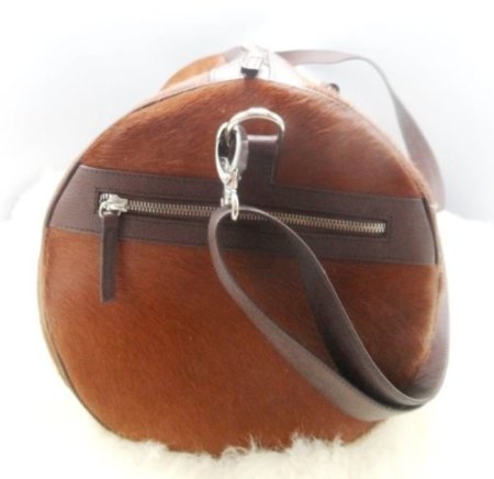 Sphere shape leather travel bag with side zipper pockets