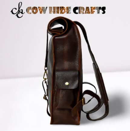 brown rolltop leather backpack side view