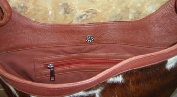 cowhide shoulder handbag