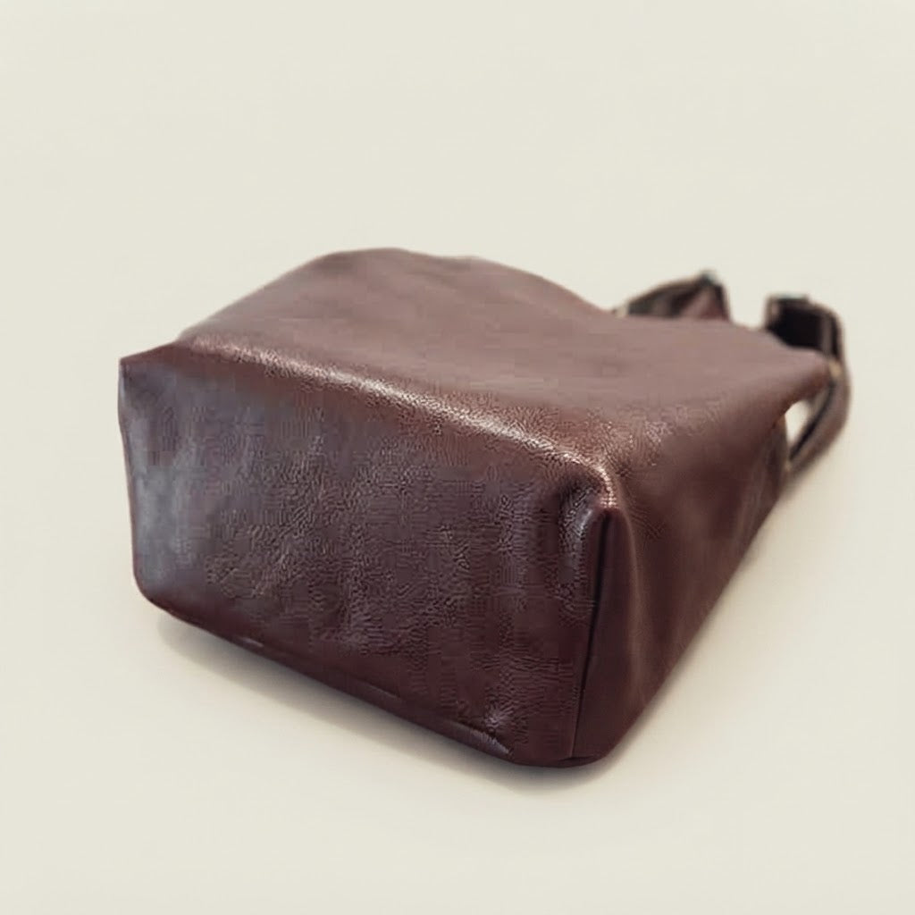 Adjustable strap detail on leather flap backpack