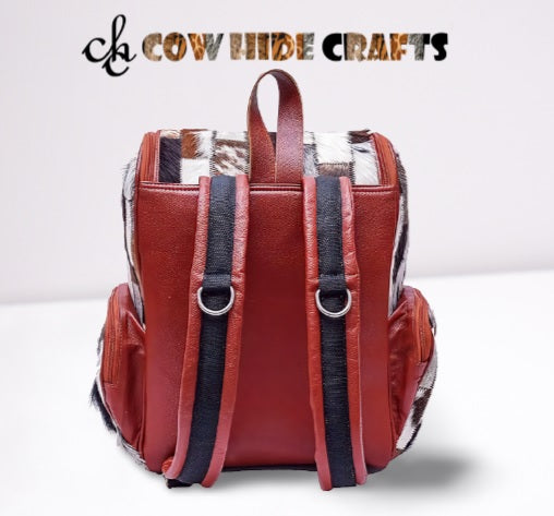 Cow hide hair on tri color patch work backpack.
