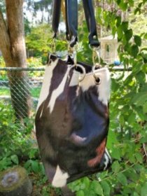 Reinforced leather base of genuine black and white hair-on cowhide square leather bucket bag