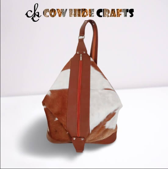 Tan white cowhide bucket bag lined interior