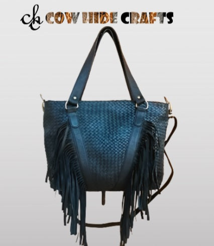 Genuine full-grain leather tote bag with reinforced stitching and brass hardware