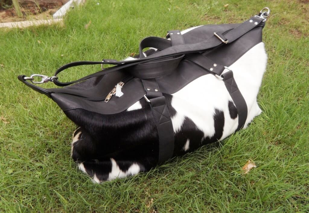 Black and white cowhide luggage bag