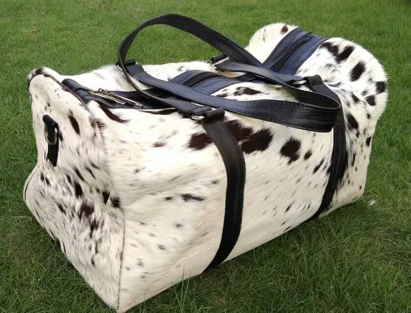 Black and white cowhide duffle bag