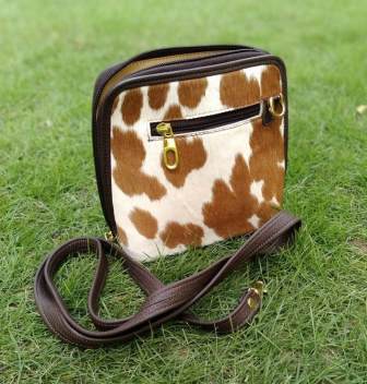 Cowhide shoulder bag with leather strap
