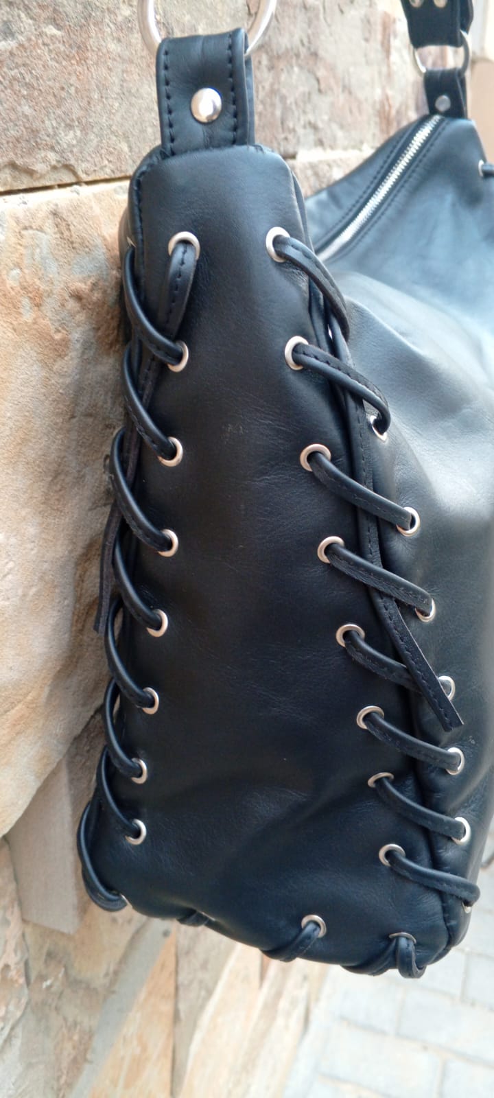 Corset lace-up leather bag silver grommet side panel detail