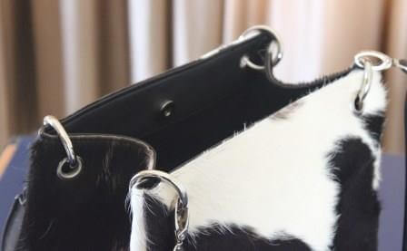 Cowhide bucket handbag with dual leather handles