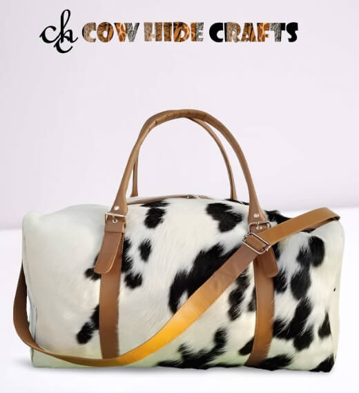 Black and white cowhide duffle bag with mustard leather