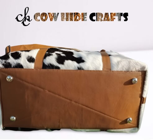 Cowhide overnight travel bag with strap