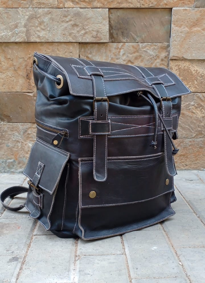 Full-grain leather military rucksack brass buckle flap top