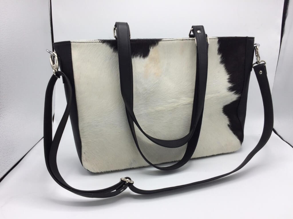 Leather briefcase purse made from cowhide with leather side panels