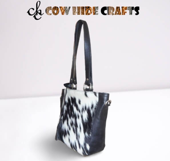 Square cowhide bag with black leather strap