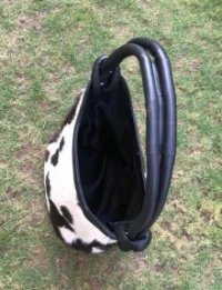 Hair on cowhide bucket bag magnetic closure
