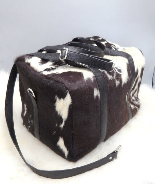 Medium cowhide duffle bag with leather handles