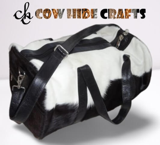 Black and white cowhide weekend duffle bag for camping.