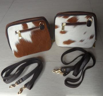 Small cowhide bag tan and white with long strap