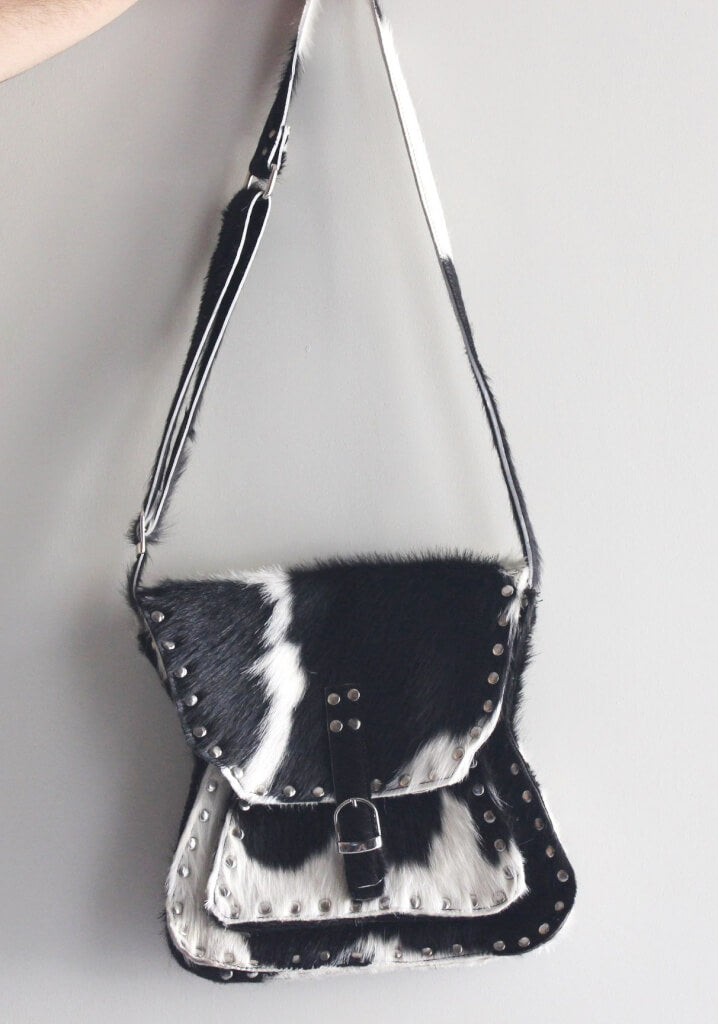 Side body leather bag black and white cowhide flap closure