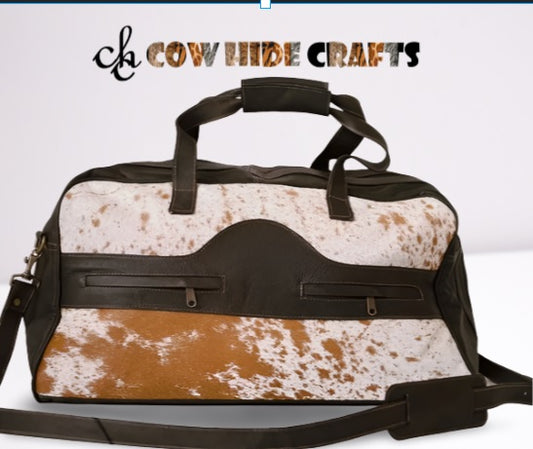 Tan and white cowhide duffle bag