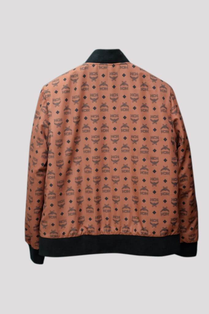 Tan leather bomber jacket with stylish brand printing elastic cuffs and mock collar