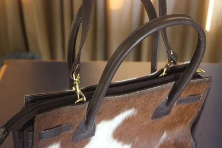 Western cowhide purse with zipper closure and inside pocket