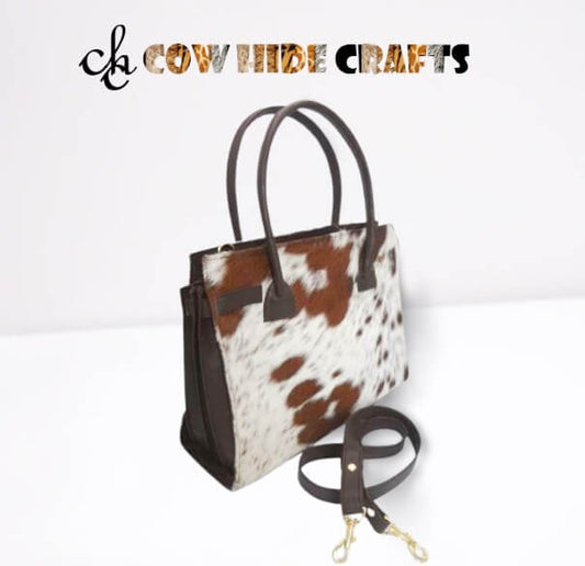 Tan and white cowhide crossbody shoulder bag with brown leather
