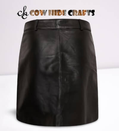 Tailor made black leather skirt with front flap pockets and snaps