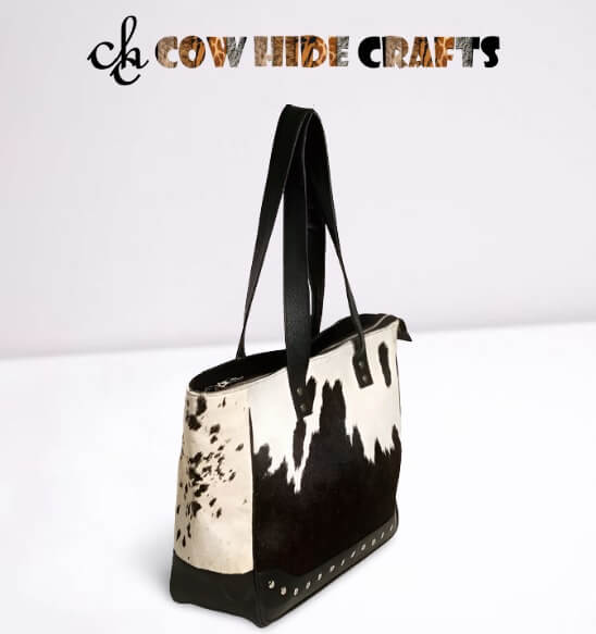 Black cowhide bag metal rivets punched front panel