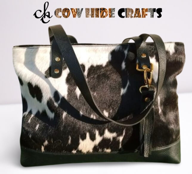 Black cowhide tote golden hardware accessories detail