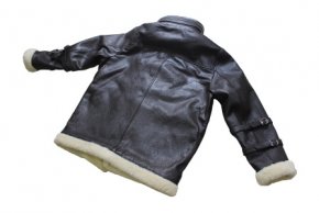 Buckle detail on the sleeve of a black biker jacket