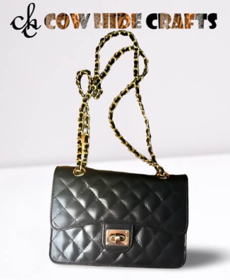 Black diamond quilted leather clutch bag gold chain front view