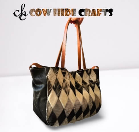 Black white cowhide bag brown leather handles