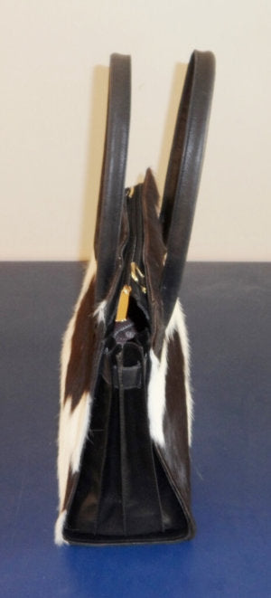 Black white cowhide shoulder bag side view