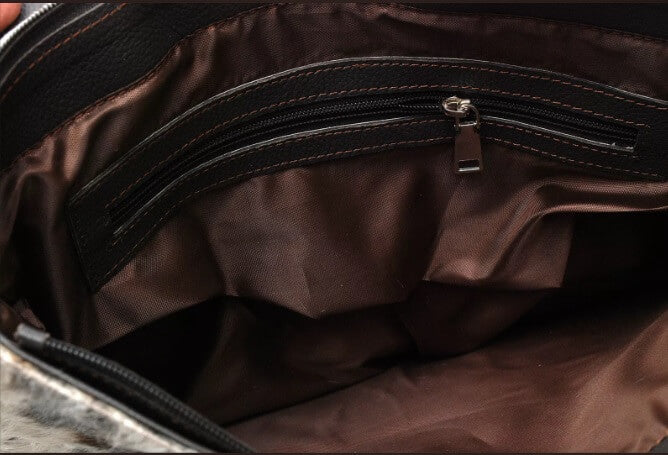 Black white cowhide tote interior pocket