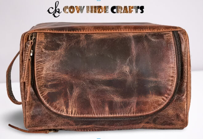 Brown leather dopp bag top zipper closure and top handle