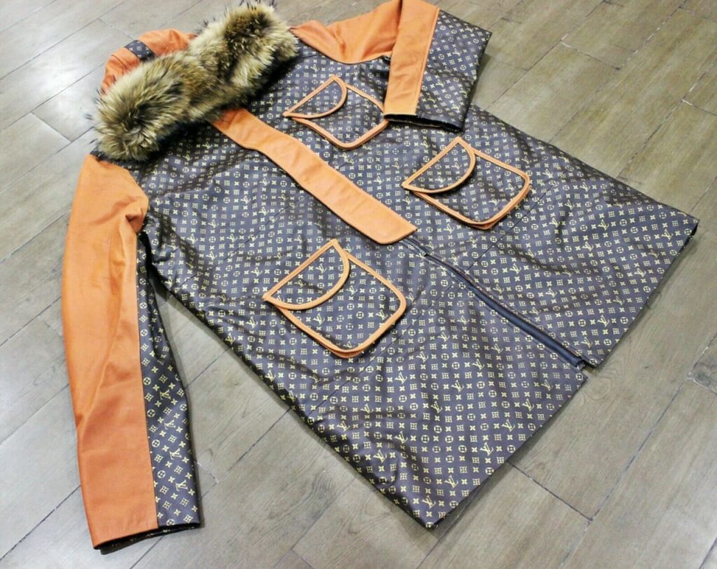 Brown leather trench coat with orange designer printing