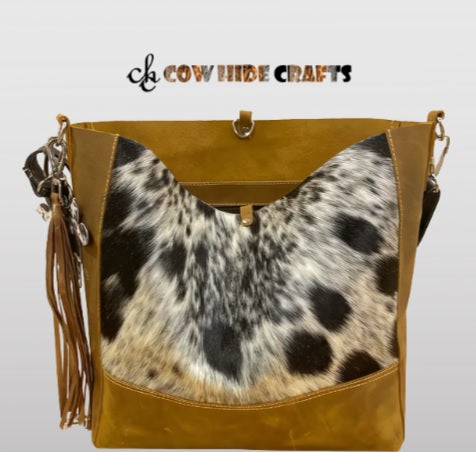Brown white cowhide clasp purse front view
