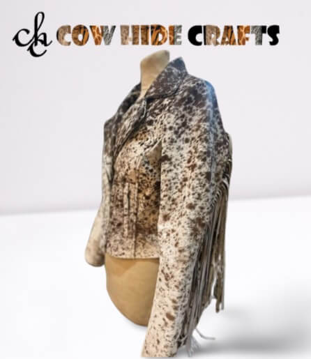 Outside pockets on a brown and white spotted cowhide jacket