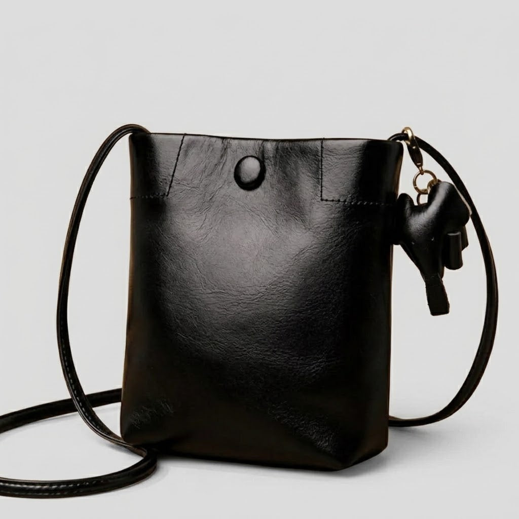 Leather bucket crossbody bag in black