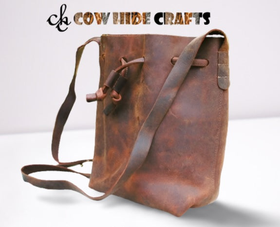 Buckle adjustable strap on brown leather vintage bucket bag