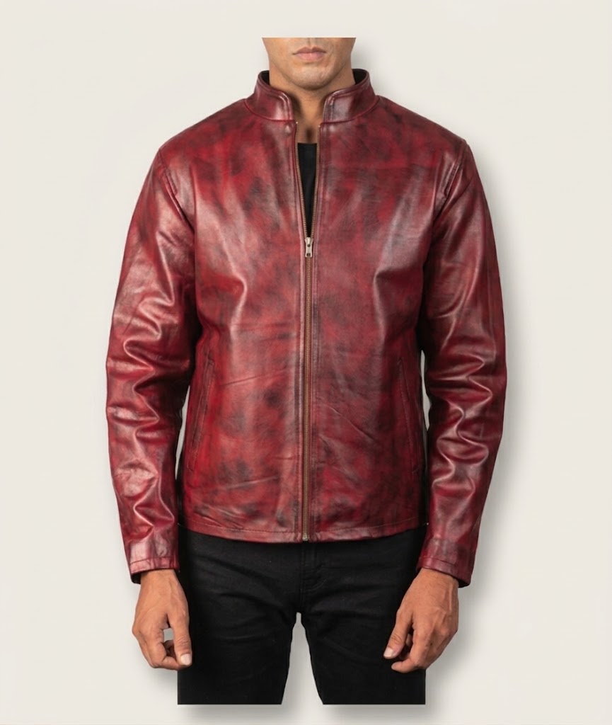 Close-up of burnished distressed texture on burgundy leather jacket