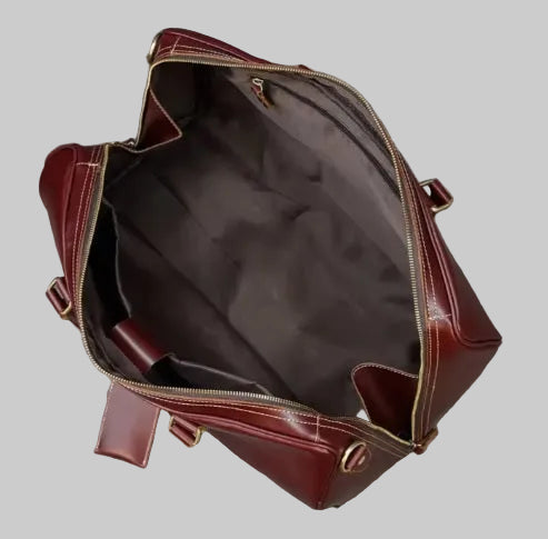 Interior lining view of burgundy leather weekend duffle bag