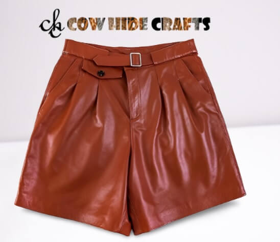 Button and buckle closure detail on tan leather mini skirt women