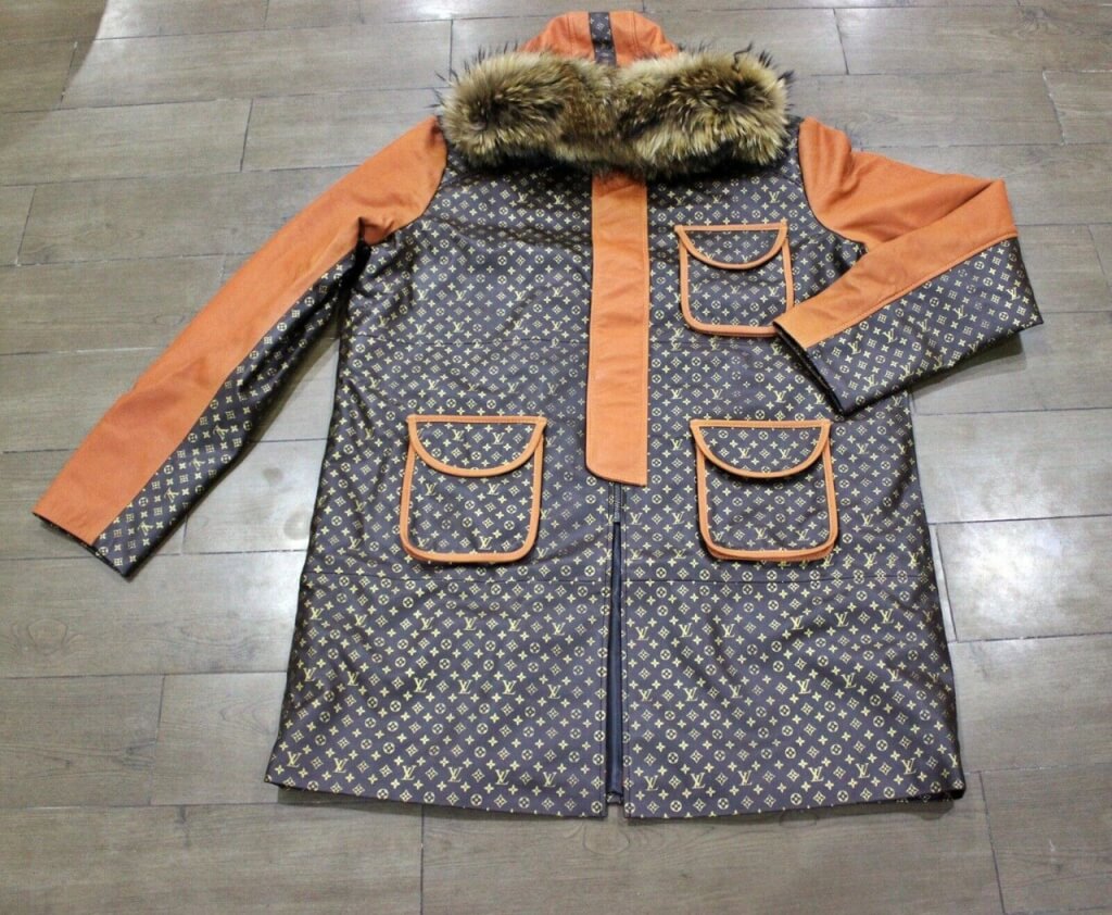 Contrast color leather coat in orange and brown designer print