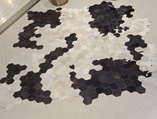 Cowhide accent rug organic edge honeycomb black cream