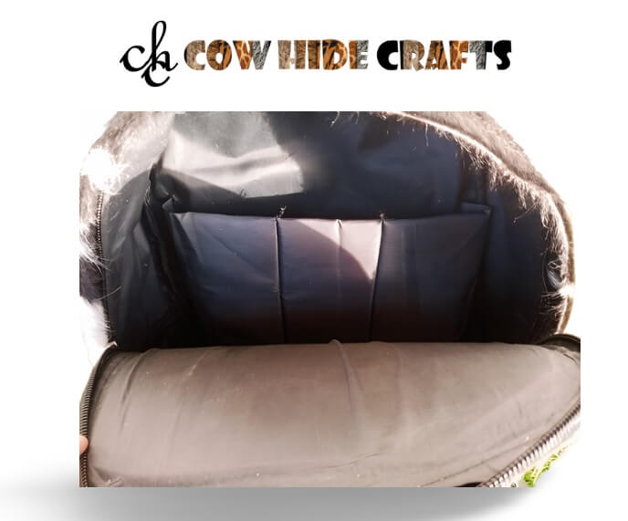 Cowhide backpack interior with laptop sleeve compartment